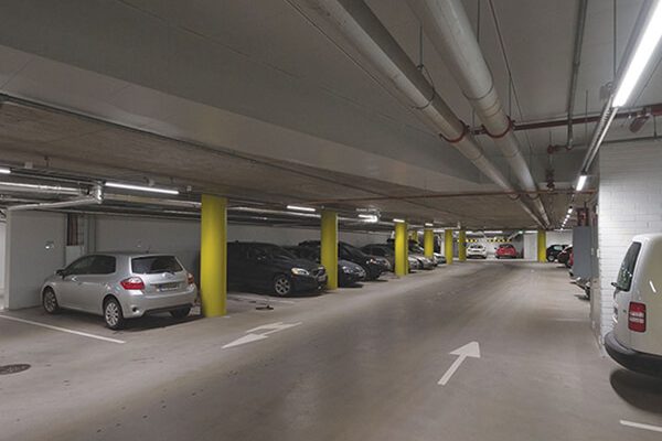 LED tri-proof lighting installed in an indoor parking garage.