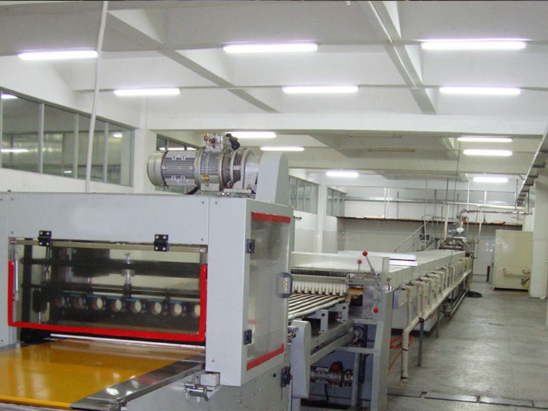 Energy-efficient LED lights brightening a production facility