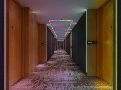 LED linear lights embedded along the hallway baseboard